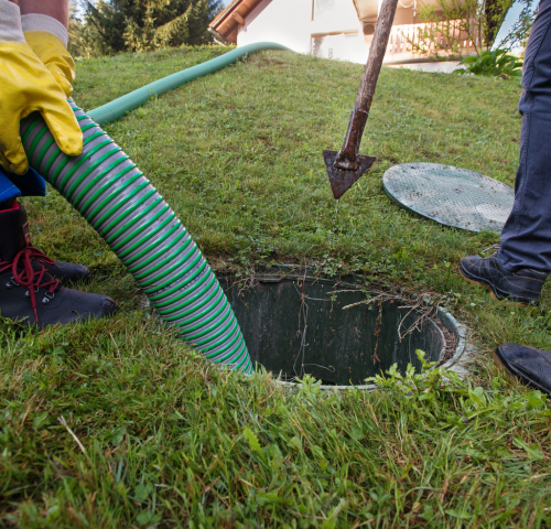 Septic tank under lawn being cleaned