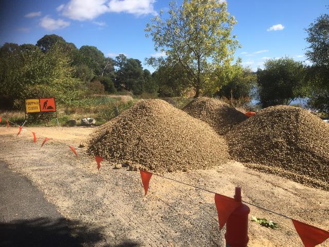 Construction site with safety bunting in lake side location