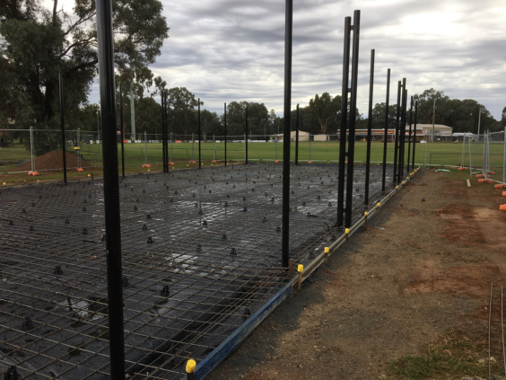 Construction area near green oval showing new cricket nets concrete slab almost ready to be poured