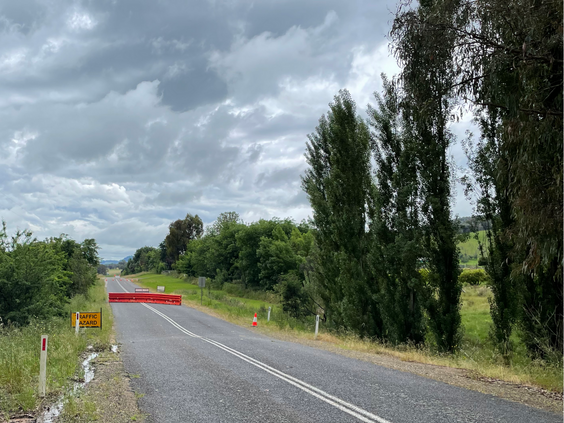 Indigo Creek Road with barricades and road work signs